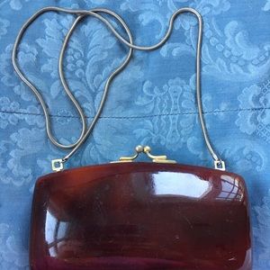 Tortoise like evening purse with vanishing  chain